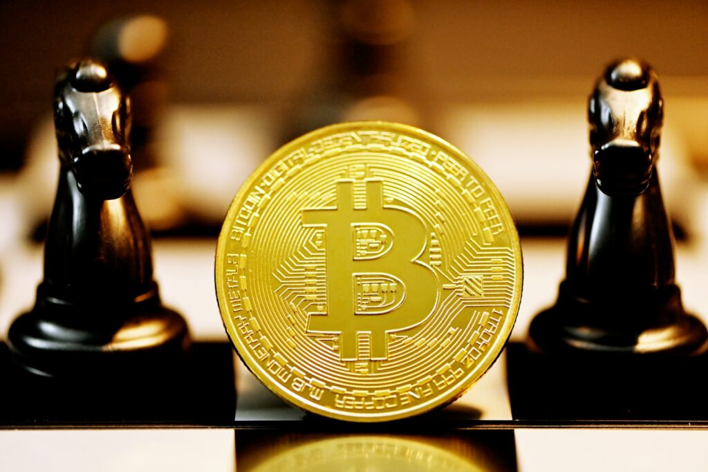 gold round coin on black metal stand